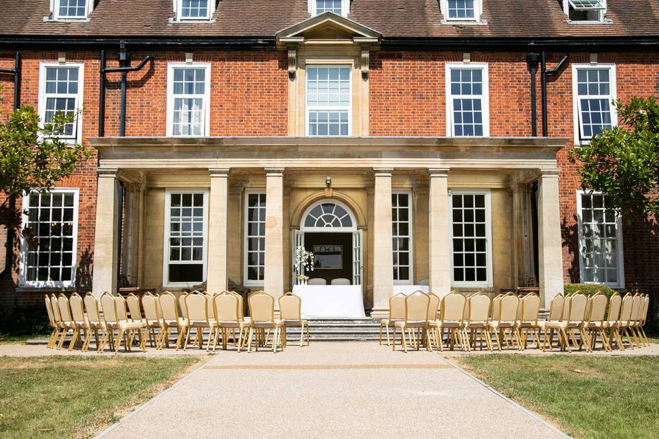 Wedding Ceremony in The Garden Room. Photograph by Ani Evans