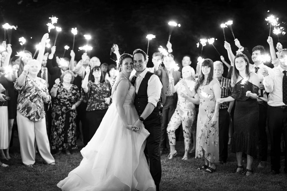 Couple and guests smiling