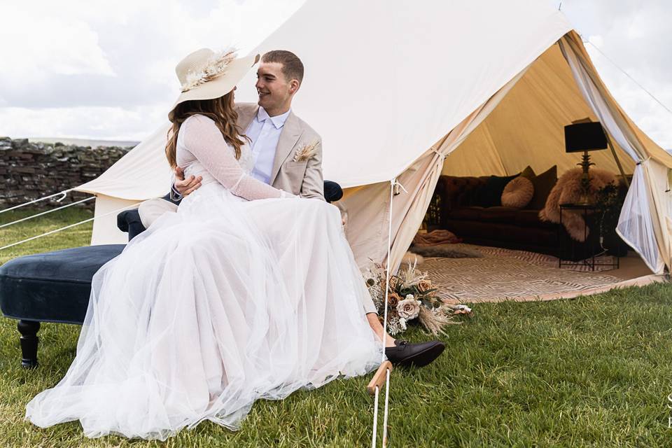 Couple outside their Bell Tent