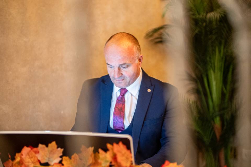 speaker presenting at reception dais