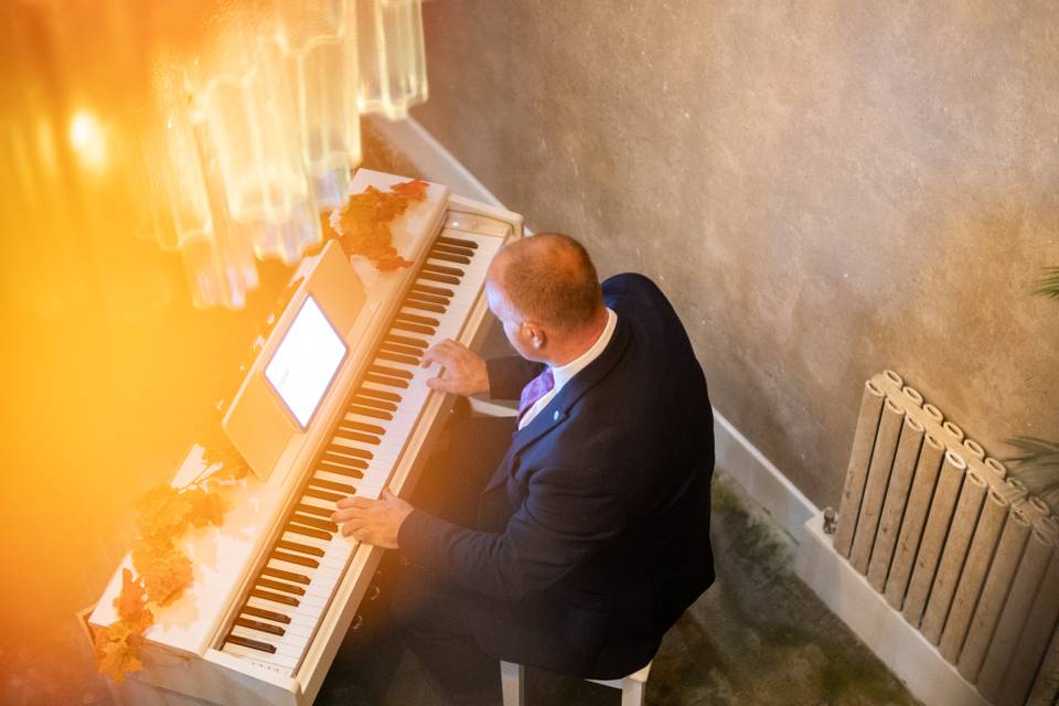 warm ambient lighting pianist at piano