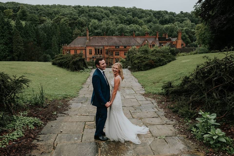 Couple in the mansion gardens at Woldingham School, Marden Park Surrey