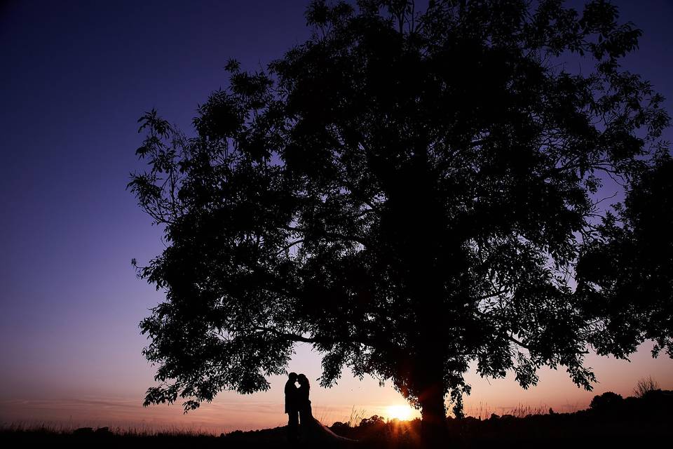 Bride and groom at sunset