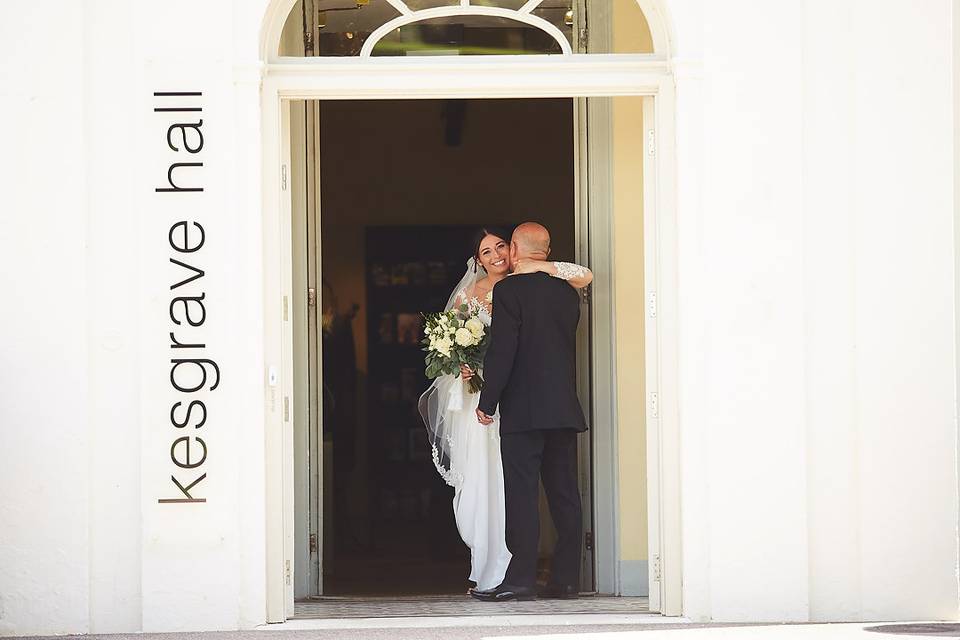 Bride hugs her father