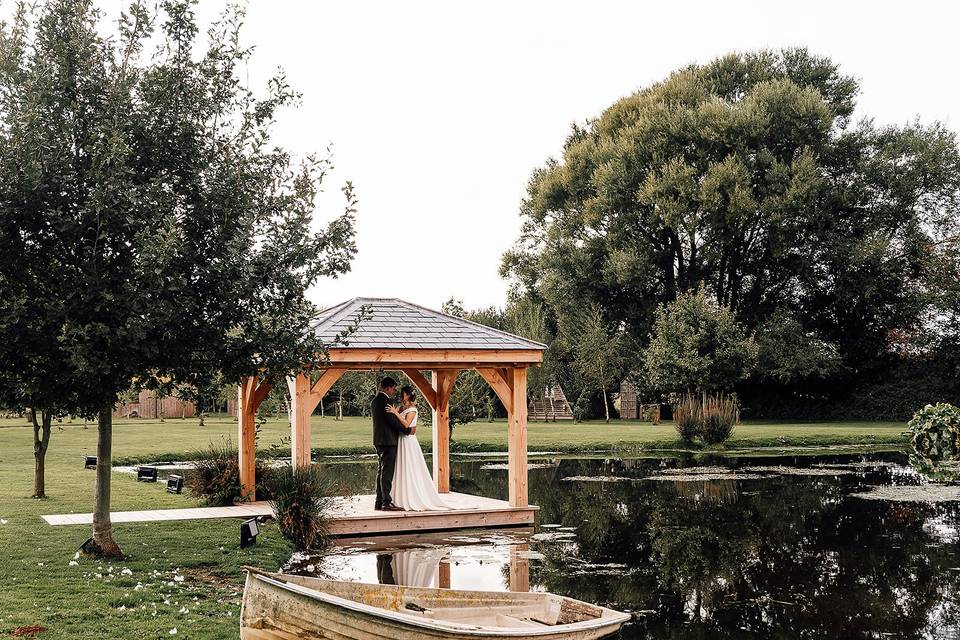 Bride and groom by the water