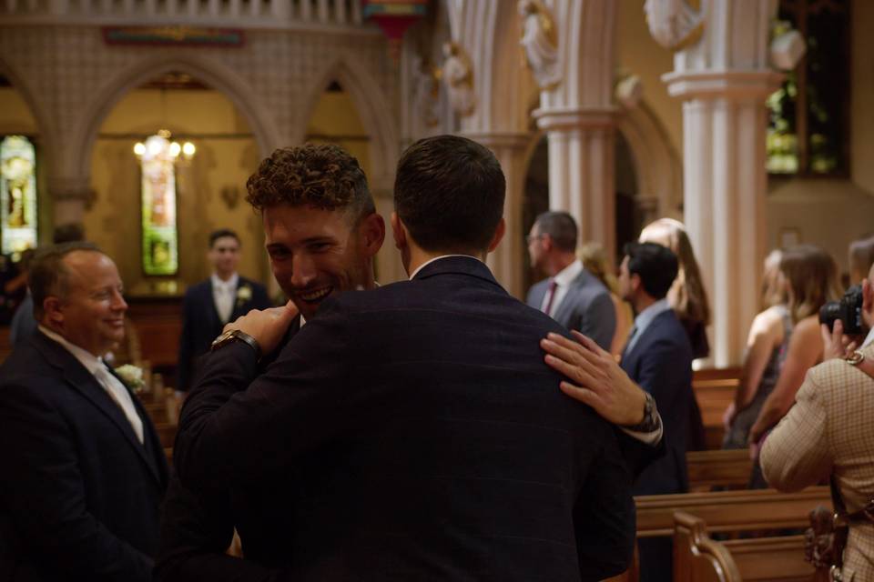 Brogan greets wedding party.