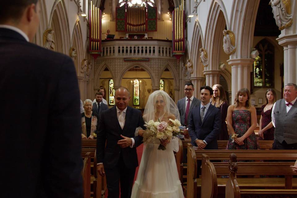 Liz walks down the aisle.