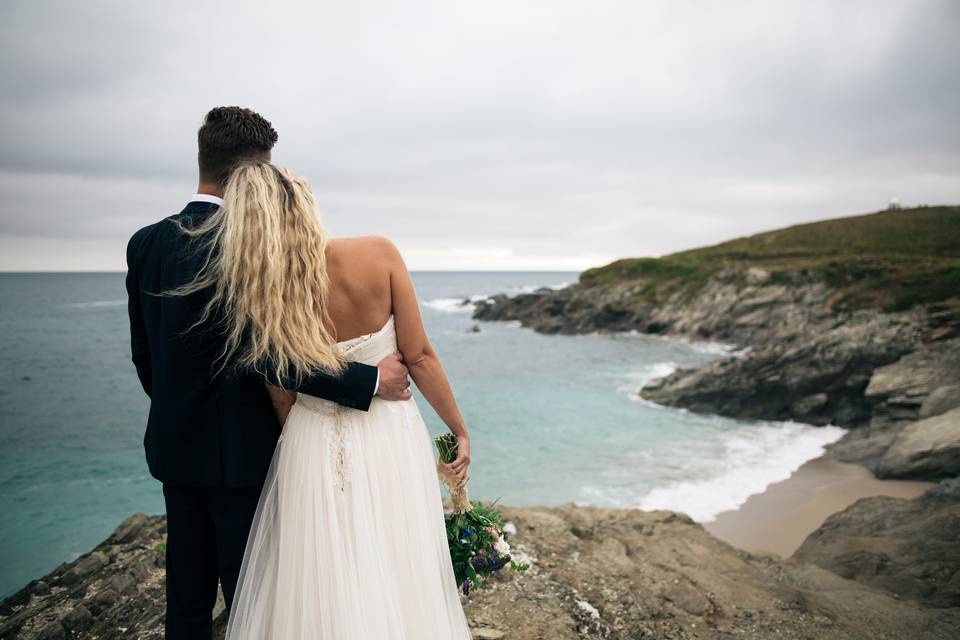 Bride and groom by the sea