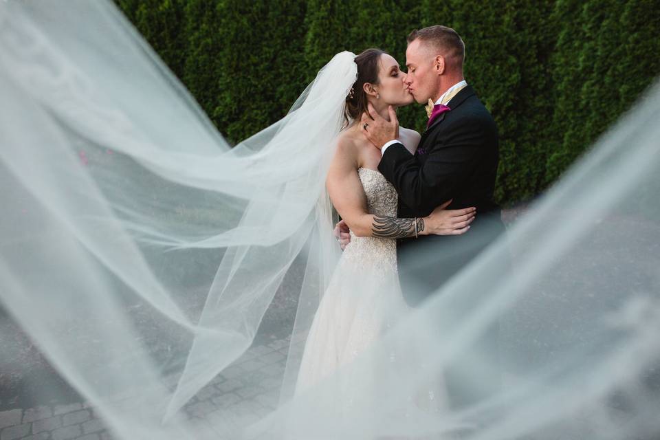 Bride and groom kissing - Thistle + Stone Photography