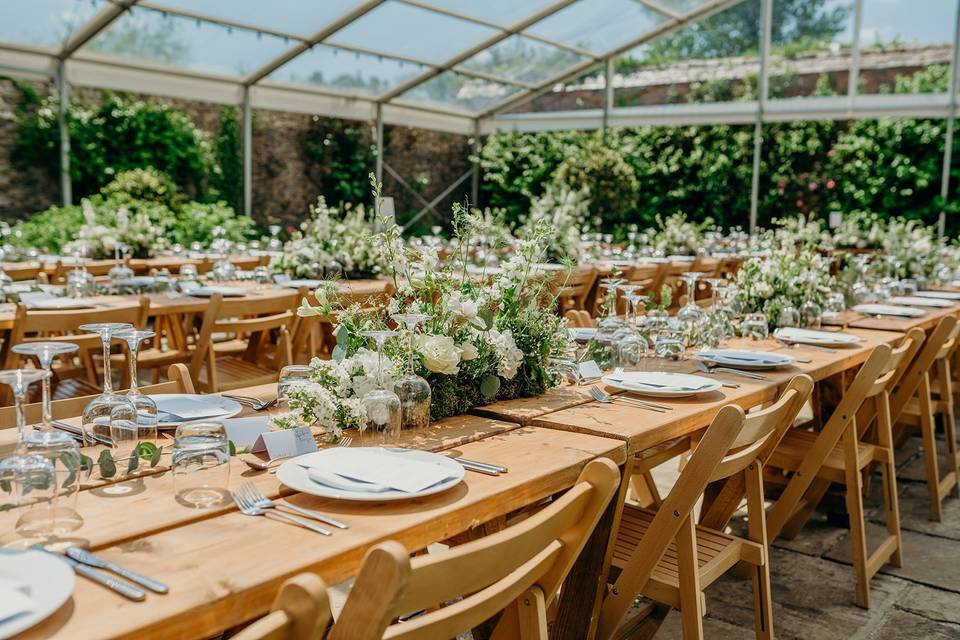 Reused aisle flowers on tables