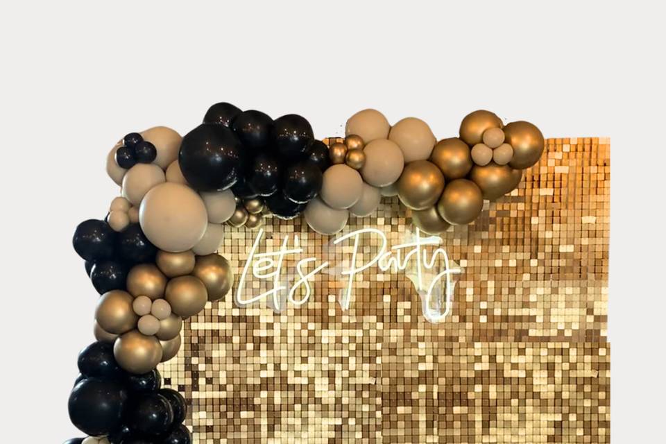 Gold sequin wall with neon