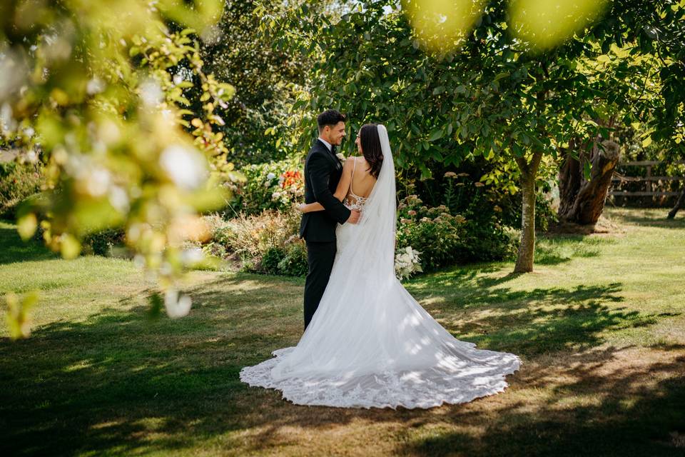 Bride and groom in gardens