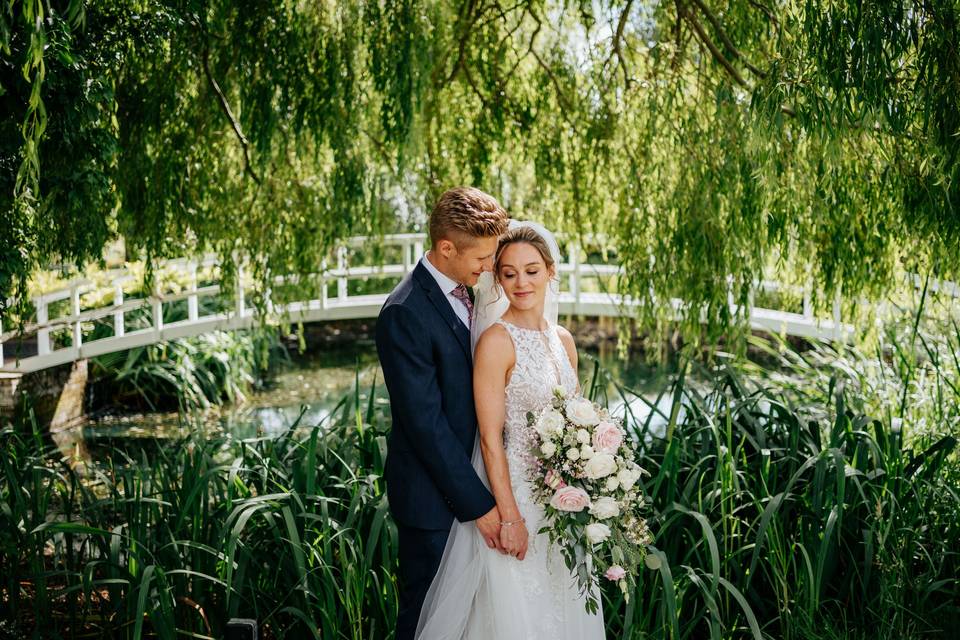 Bride and groom by Bridge