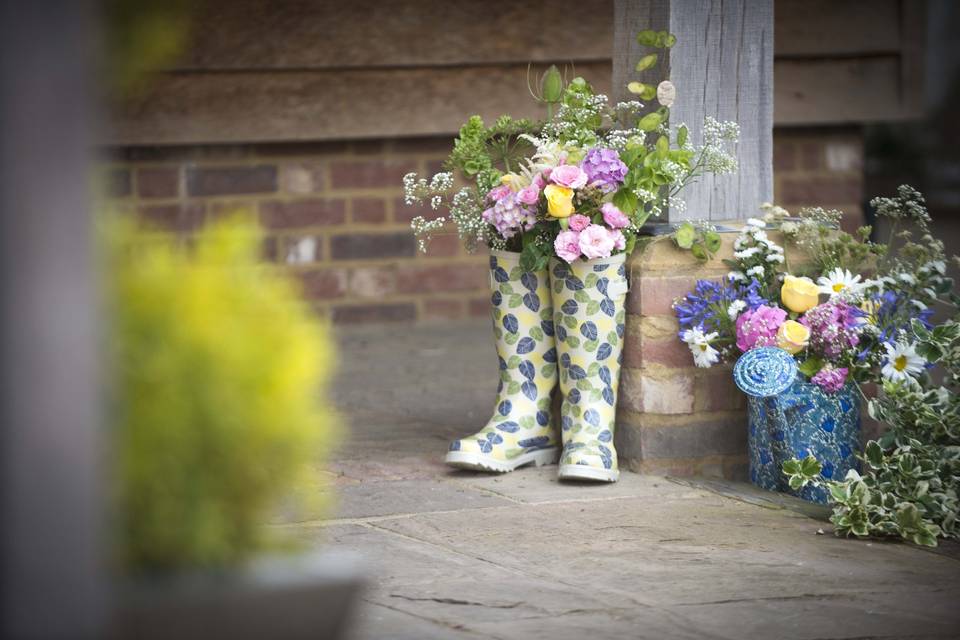 Flowers in wellington boots