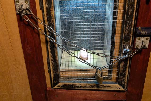 A egg locked behind chains