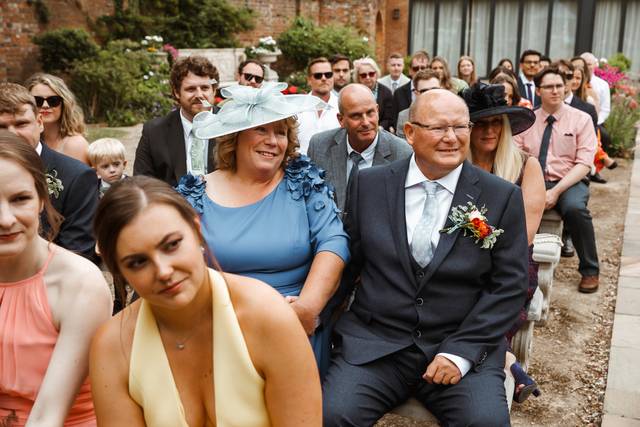 Wedding guests laughing