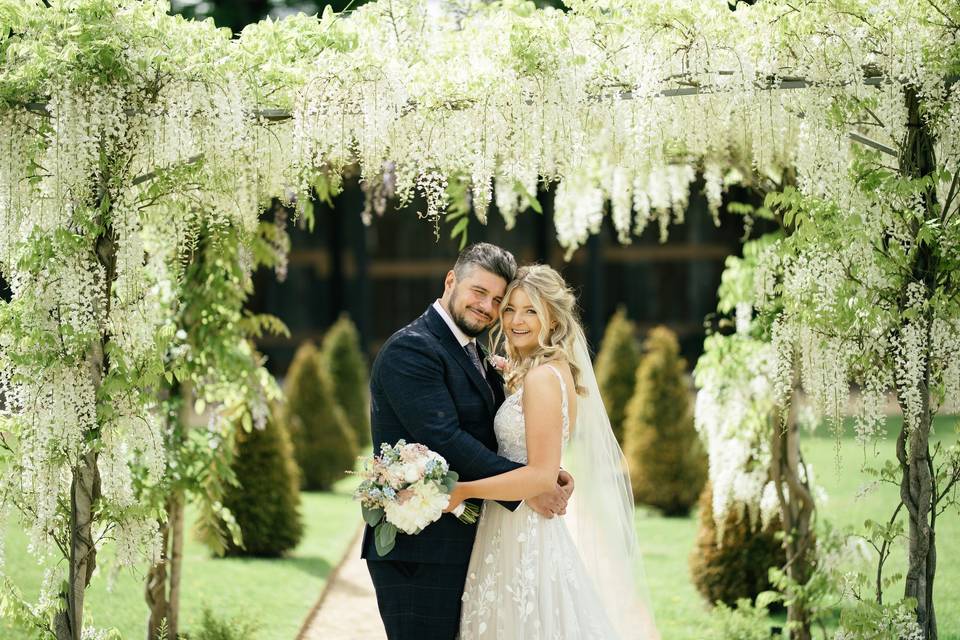 Couple under the wisteria