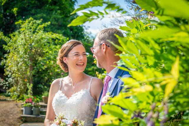 Bride laughs with Groom