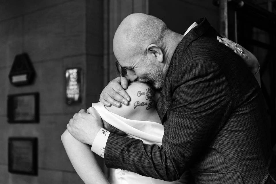 The bride & brother embrace