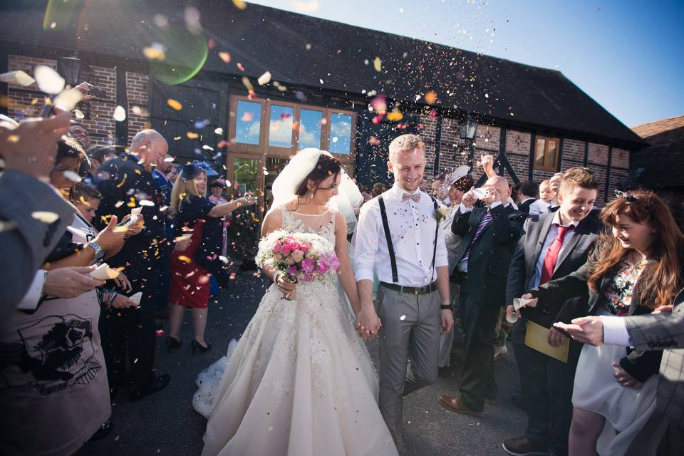 Exiting the barn to a shower of confetti