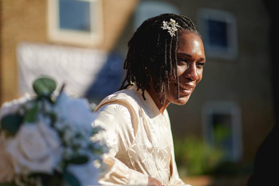Bride smiles outside