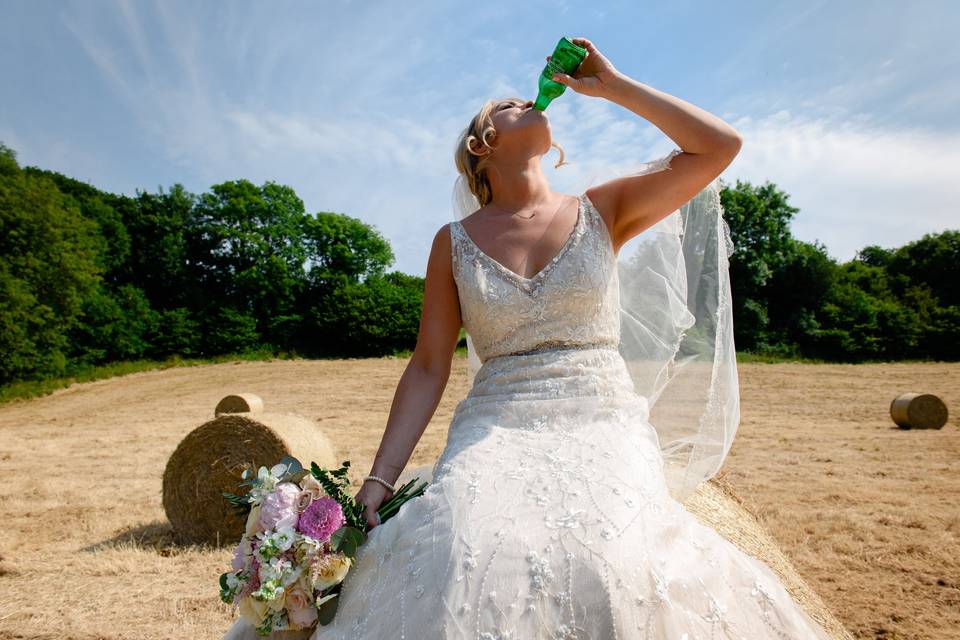 Bride drinking beer