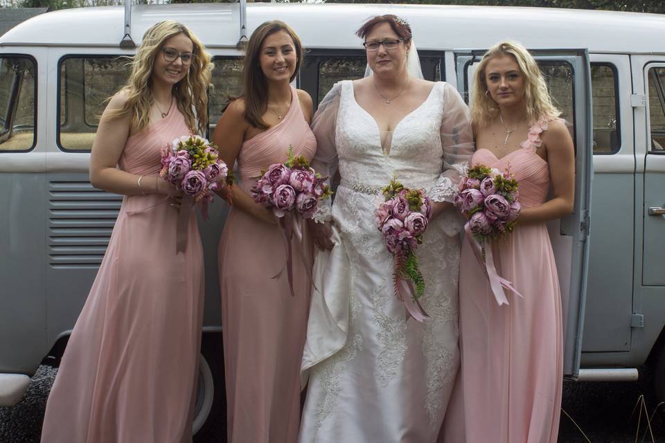 Wedding party standing by the car