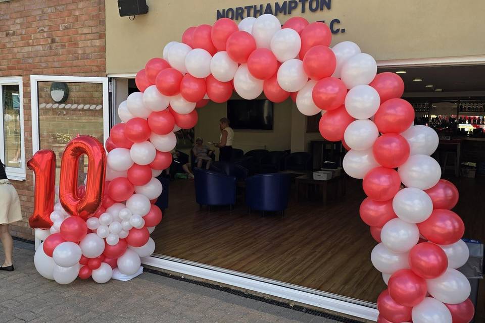 Red and white balloon arch