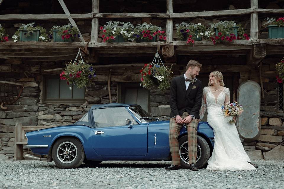 Couple and their wedding car!