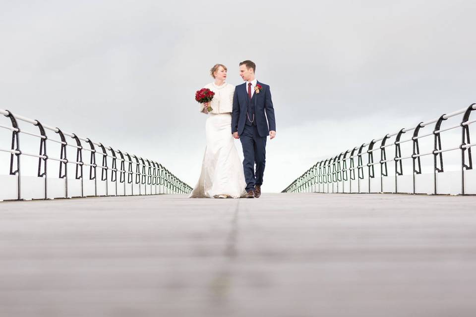 Bride & groom on pier