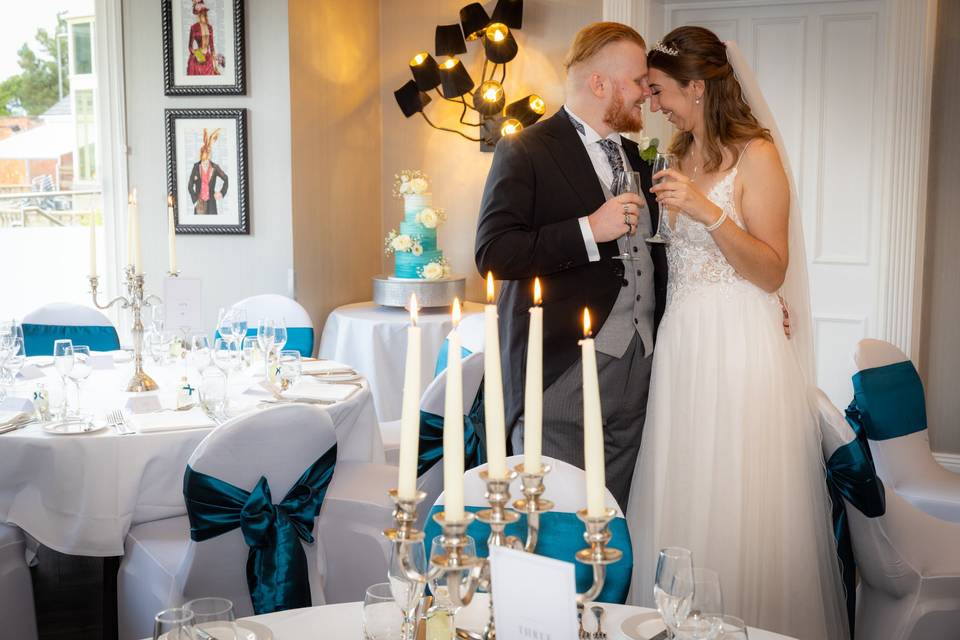 Bride and groom by the cake