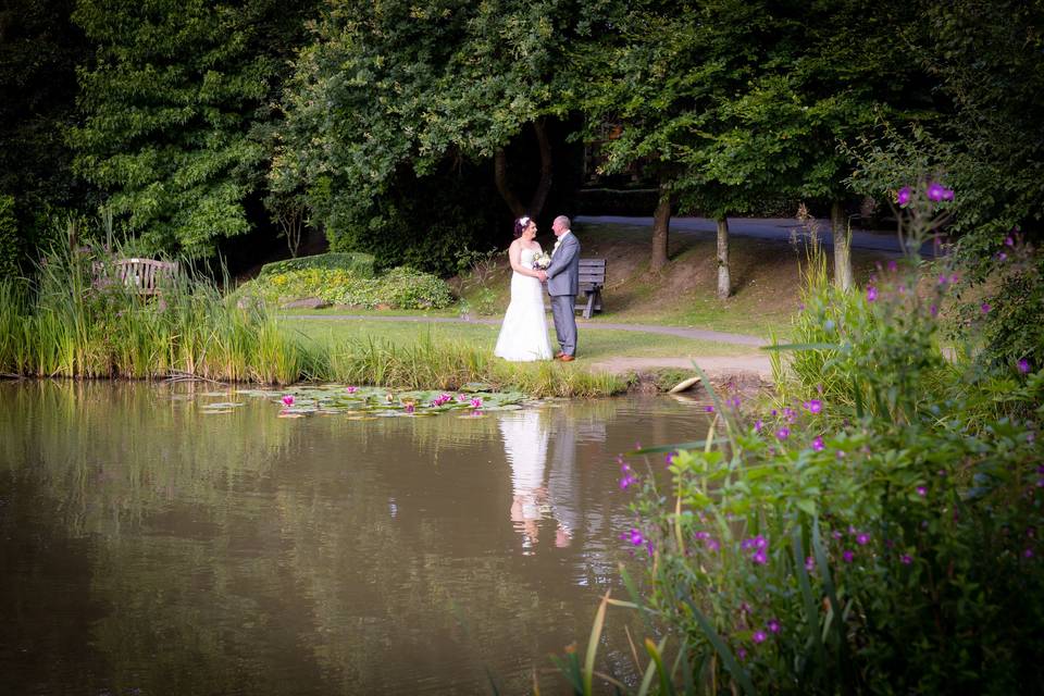 Bride and groom by the lake