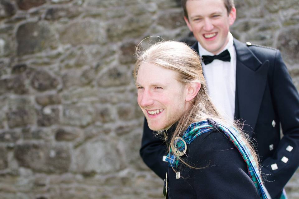 Best man laughs at the groom