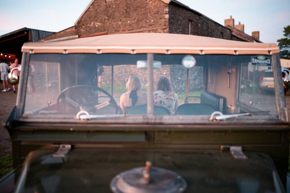 Guests sat on a Land Rover