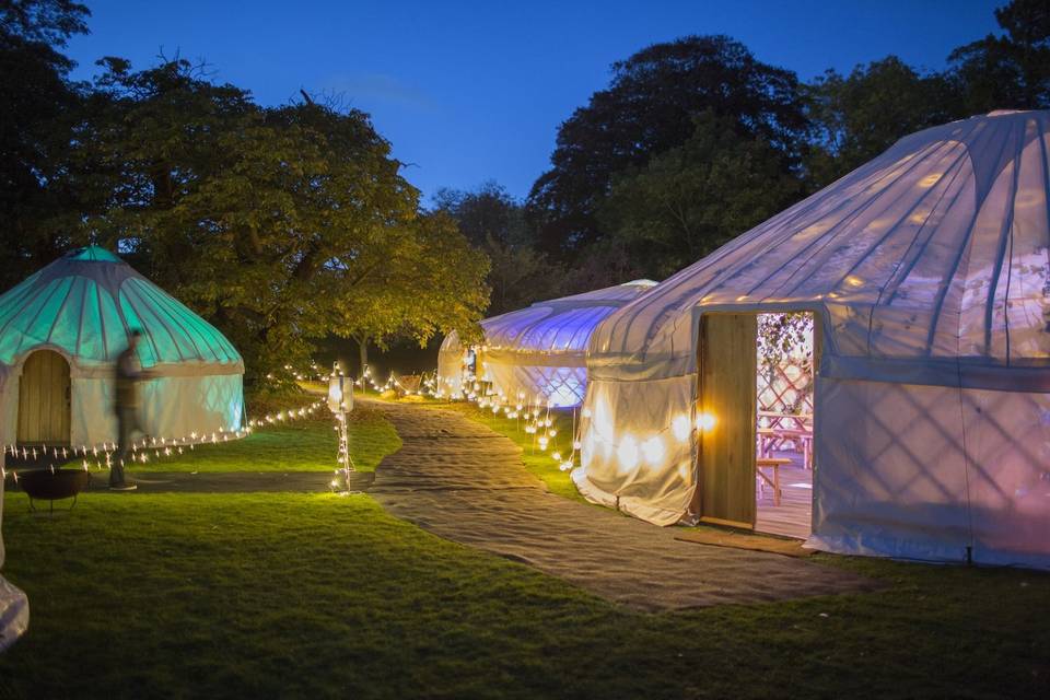 Lit-up tents by night