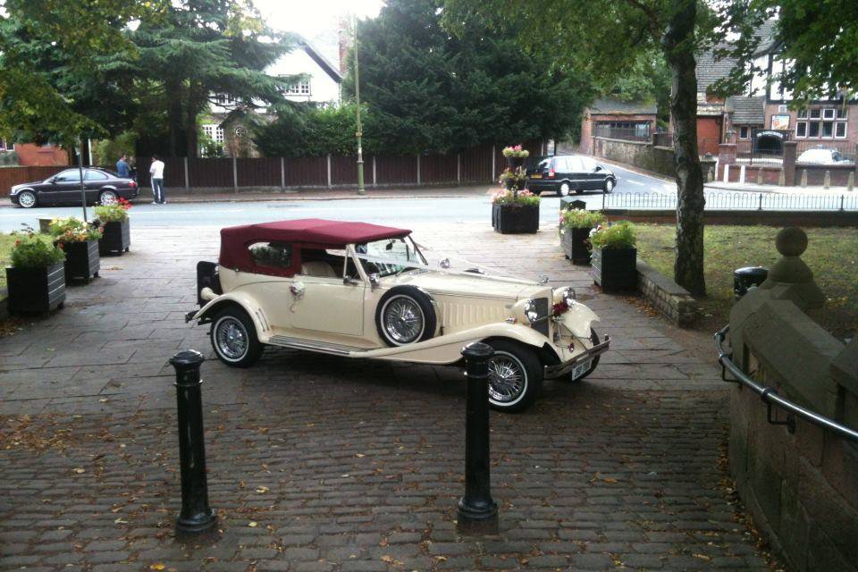 Burgundy Beauford convertible