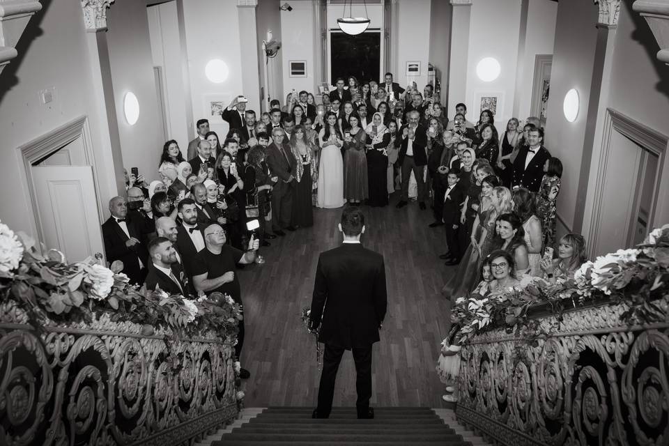 Groom surrounded by guests