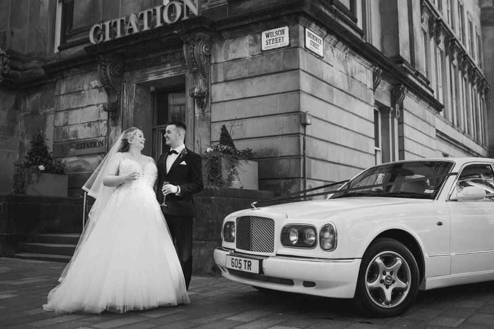 Bride and groom outside venue
