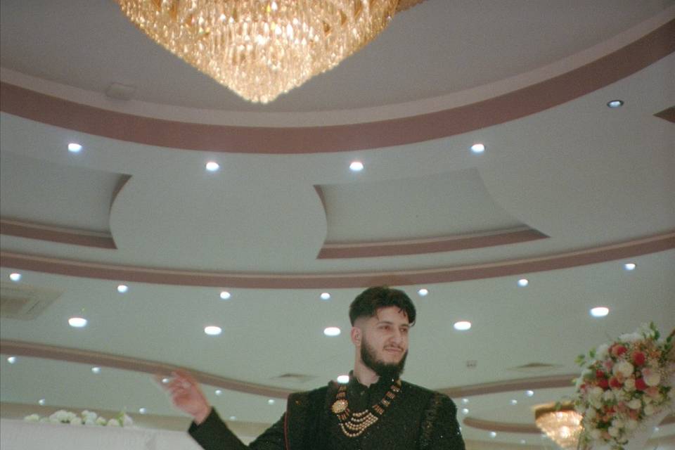Groom enters wedding reception