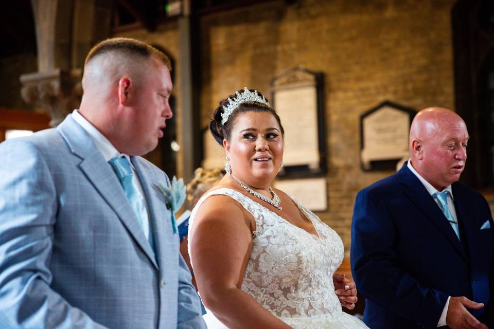 Bride and groom with father