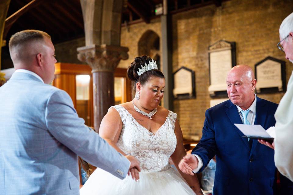 Bride and groom with father