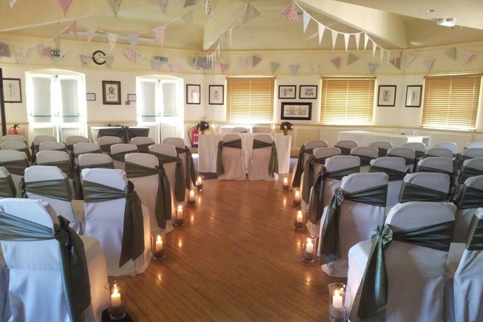 Ceremony with hurricane vases and candles