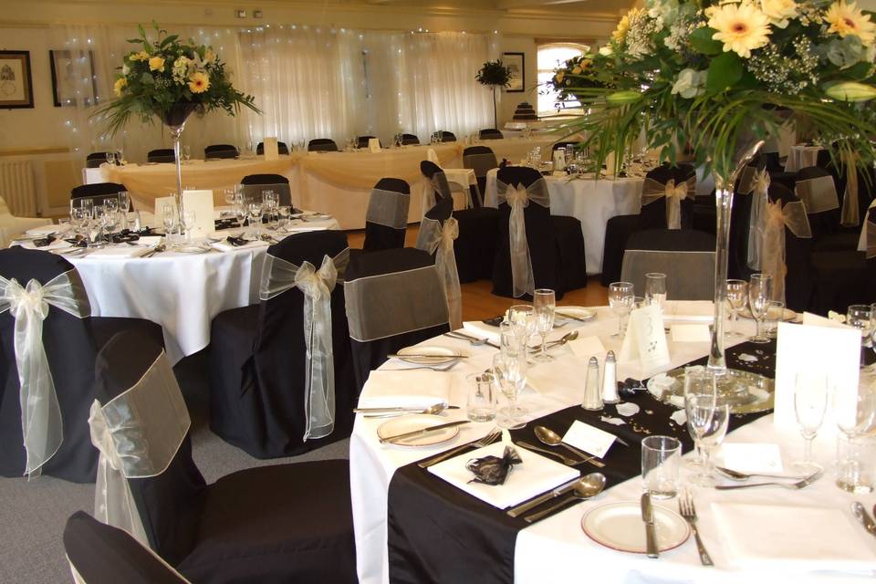 Room layout with black chair covers