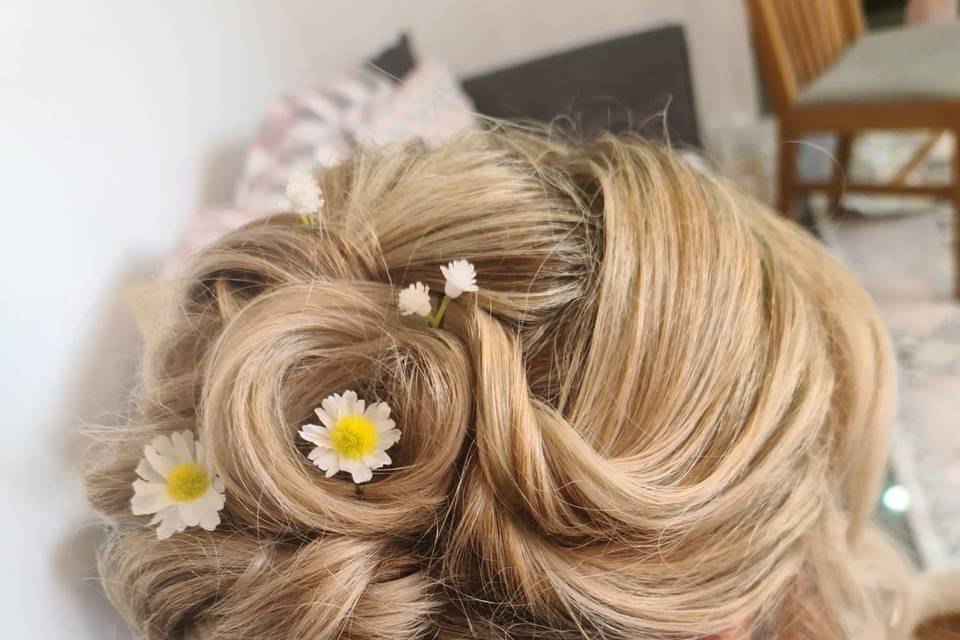 Curly bun with yellow flowers