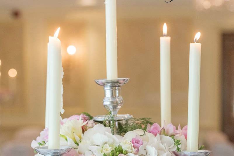 Candelabra with pink flowers