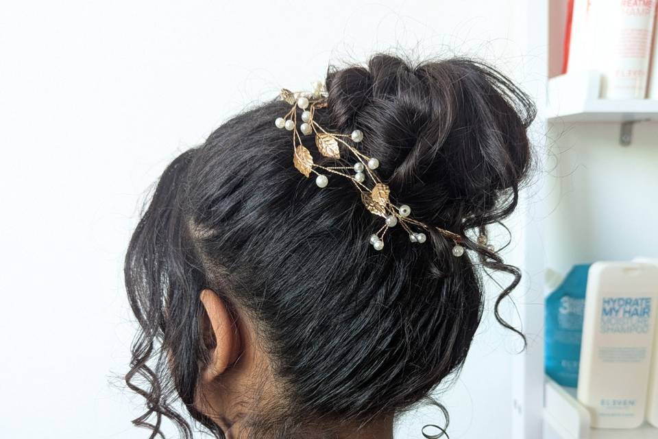 Messy bun with face framing