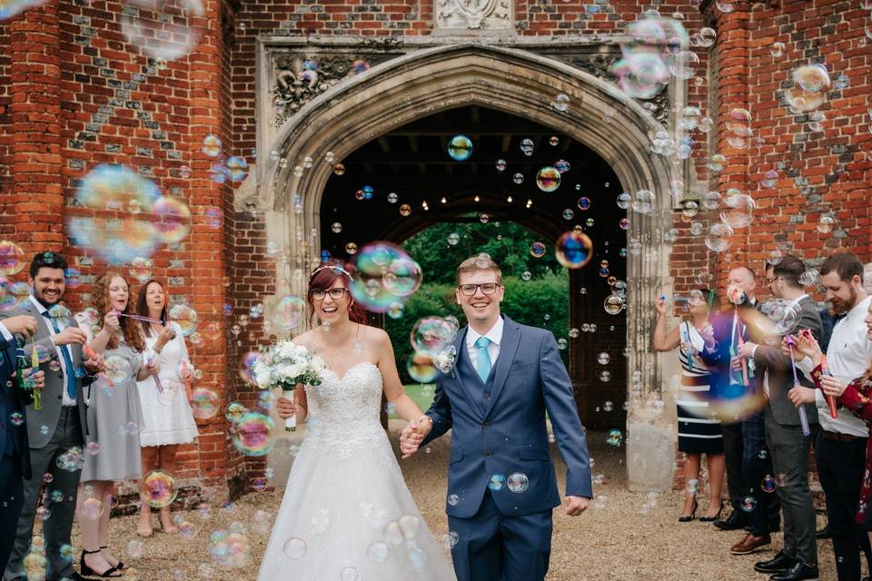 Bride and groom with bubbles