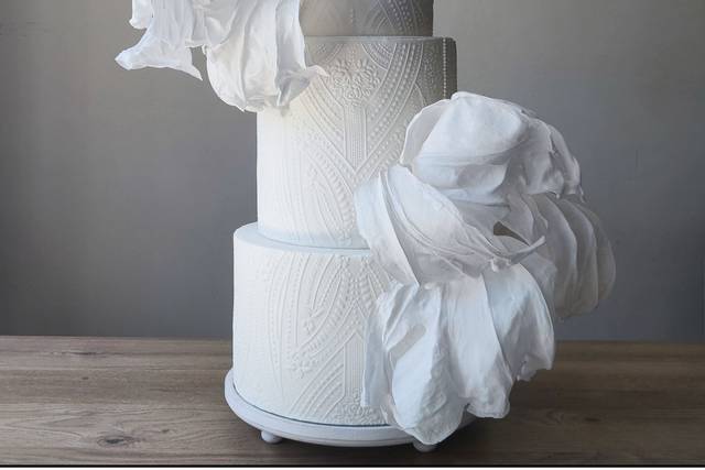 Modern white wedding cake with