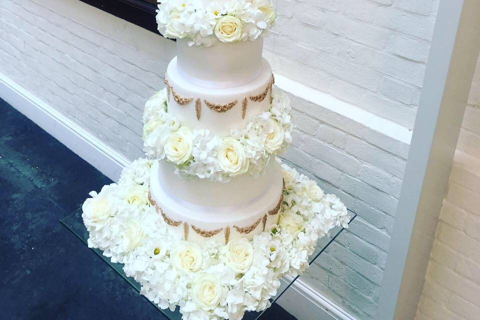 Towering cake with flower décor