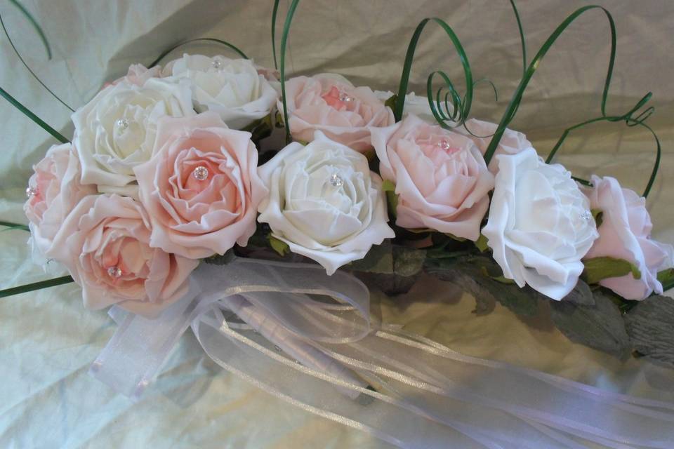 White roses with baby pink feathers